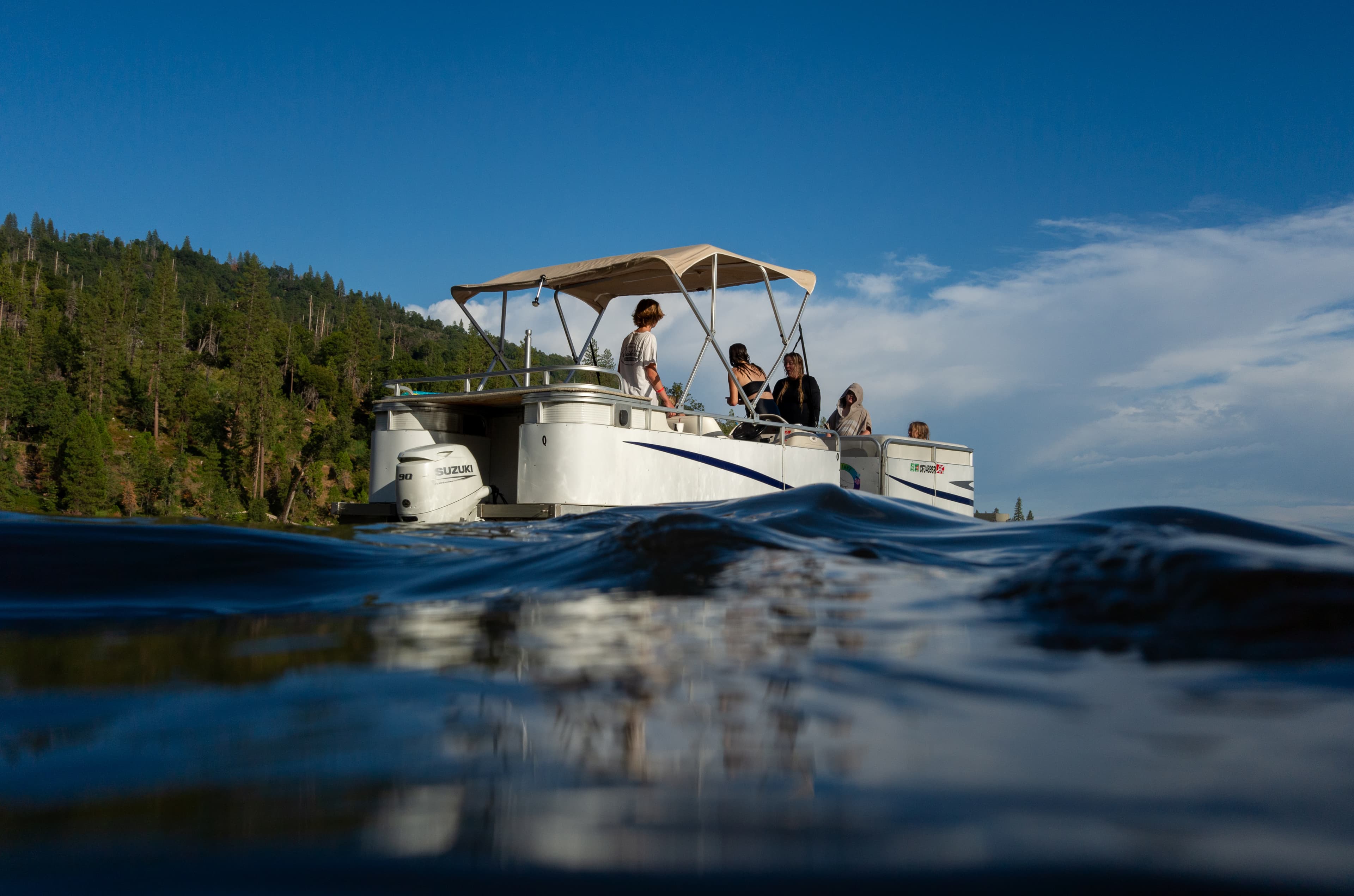 A photo of a group on a boat on the water